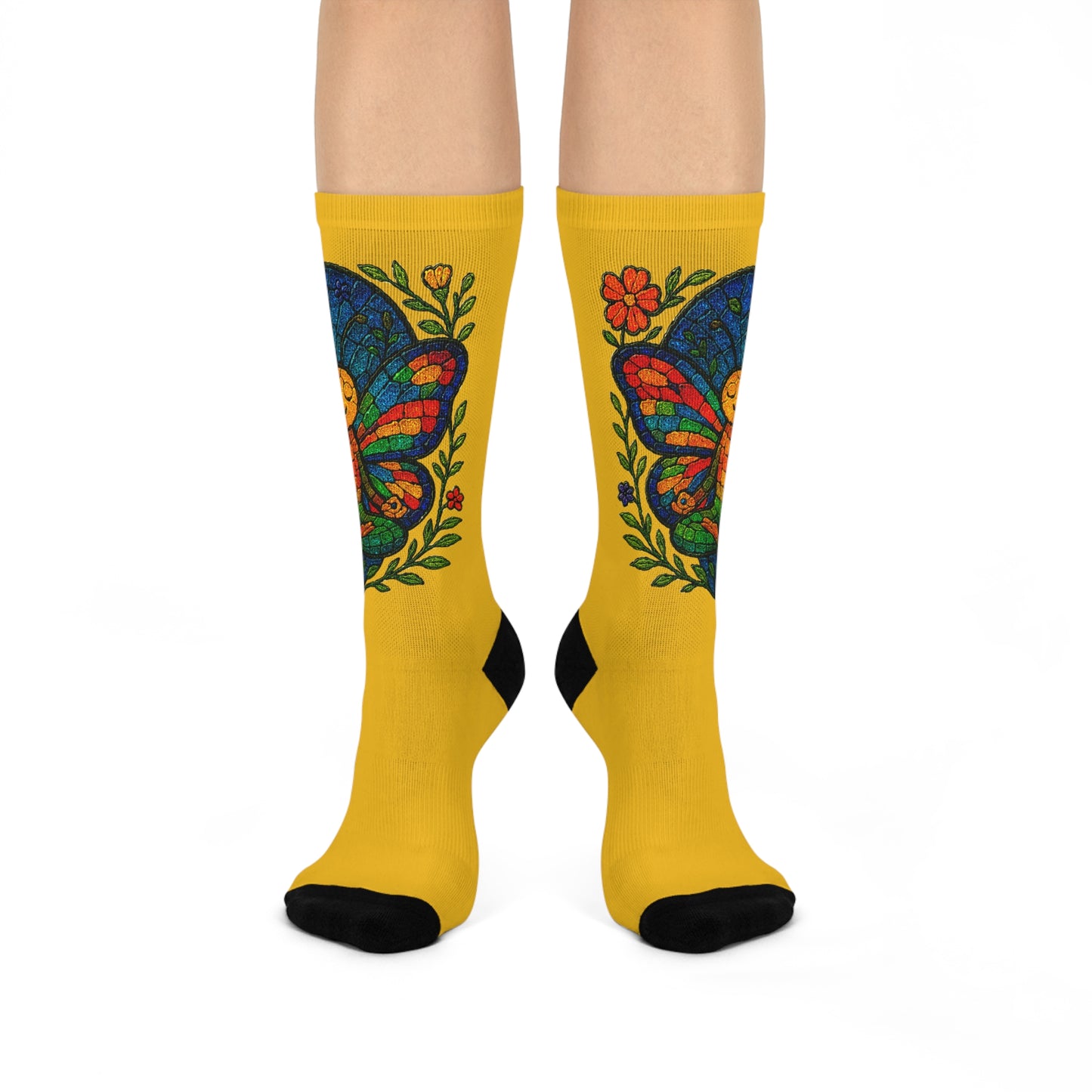 Yellow socks with colorful butterfly design on a white background