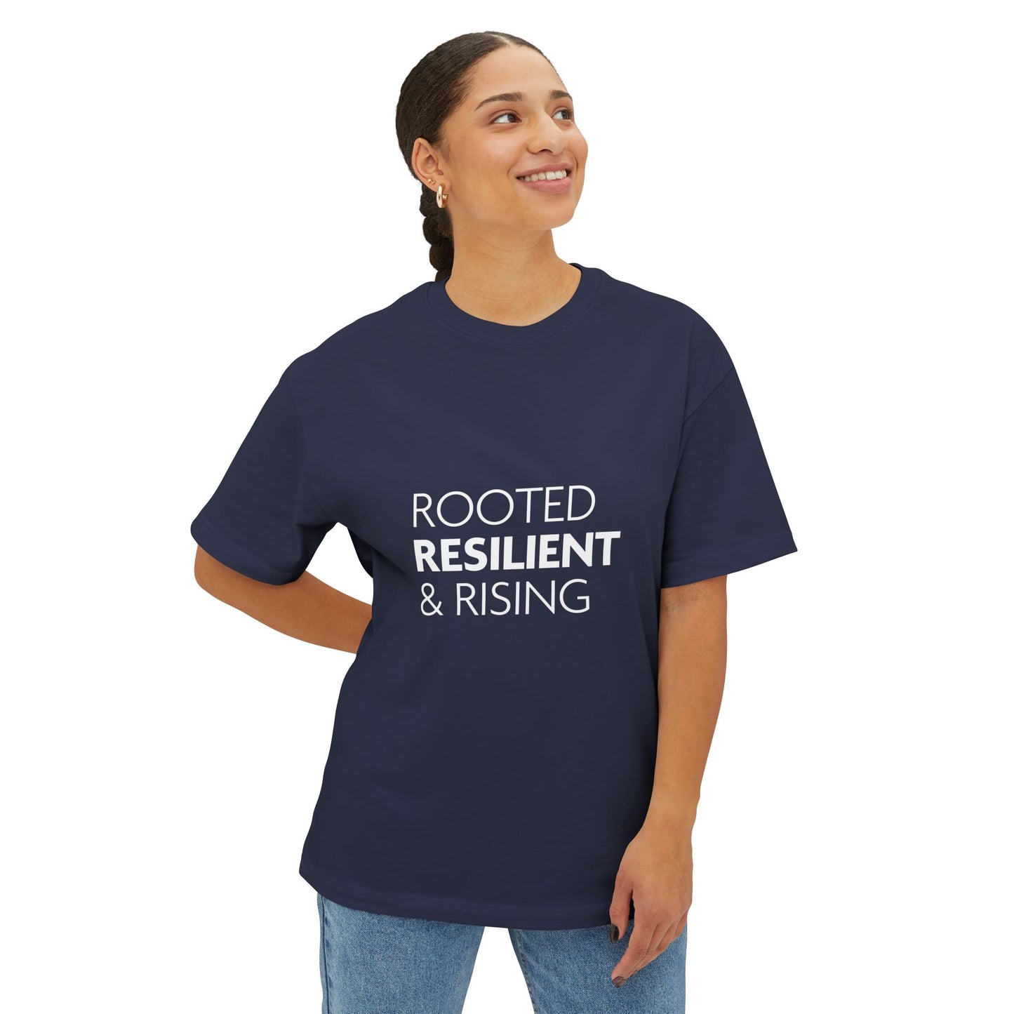 Person wearing a navy blue t-shirt with 'ROOTED RESILIENT & RISING' text on a white background