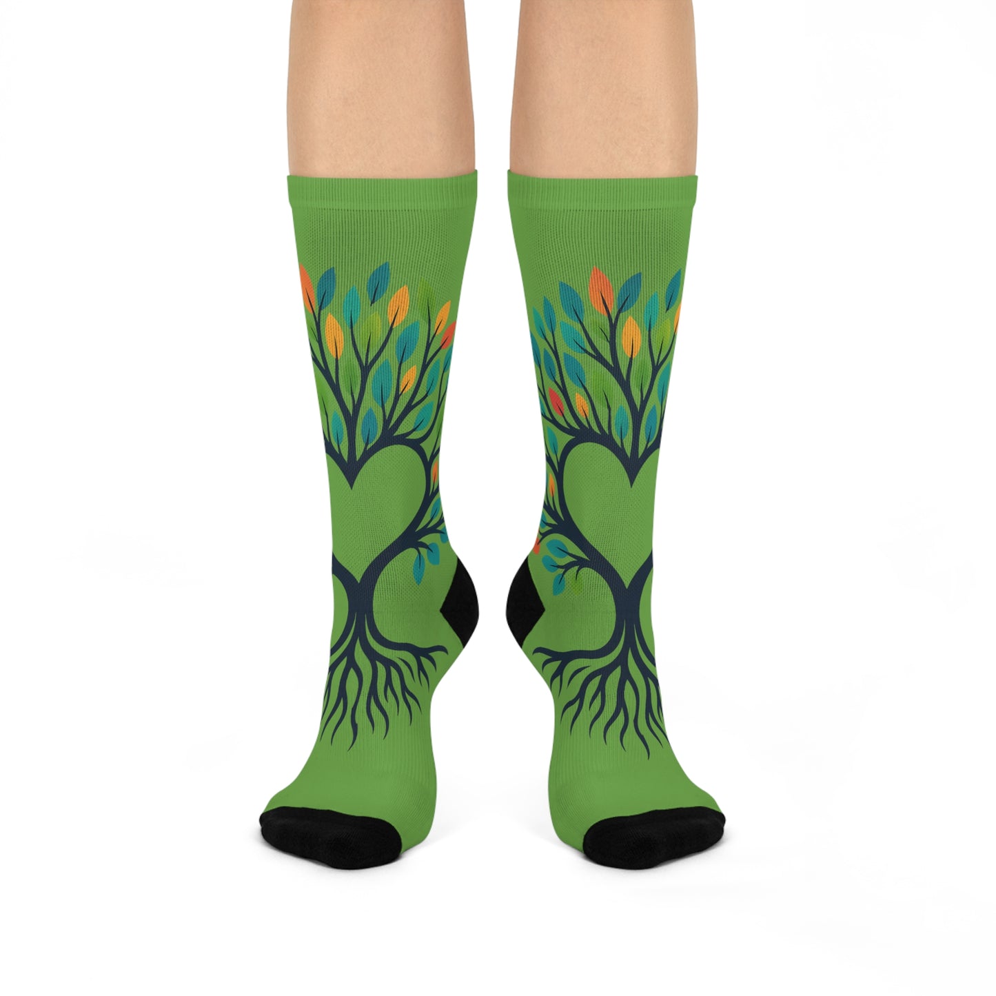 Green socks with tree design on a white background