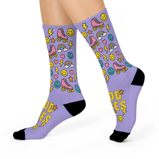 Purple socks with colorful patterns and text on a white background