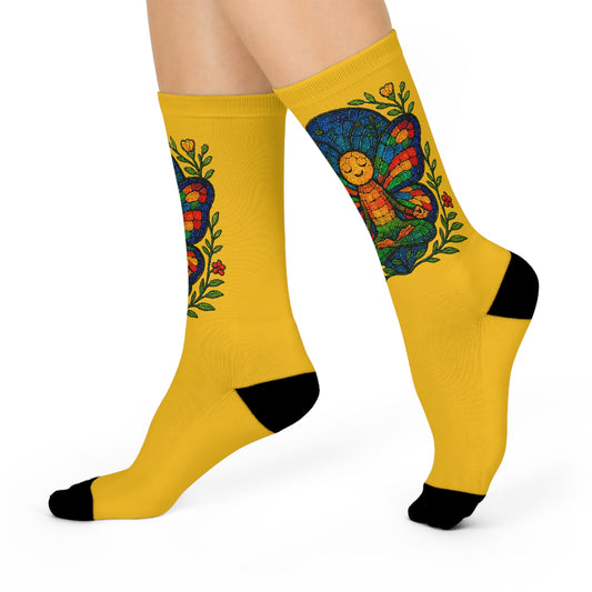 Yellow socks with colorful designs on a white background