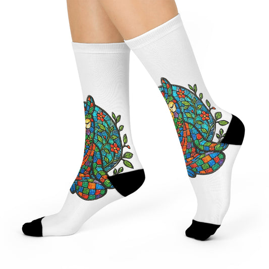 White socks with colorful llama design worn by a person on a white background