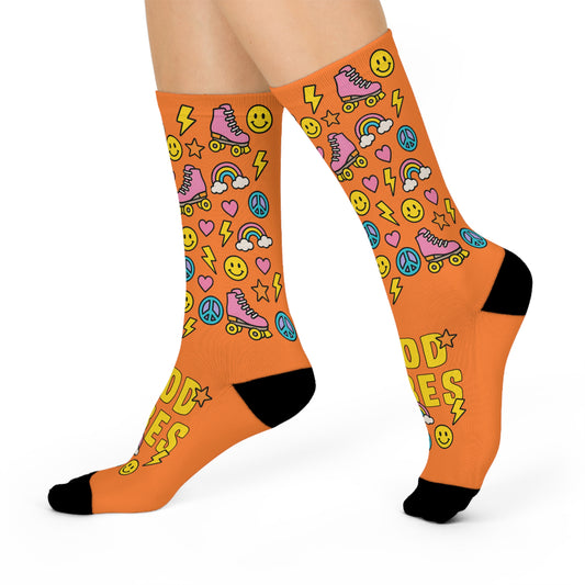 Orange socks with colorful patterns on a white background