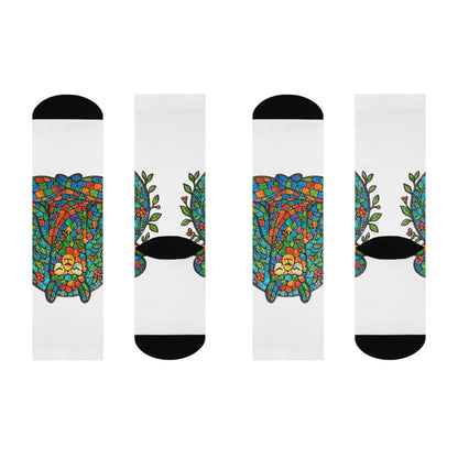 Four socks with colorful llama designs on a white background