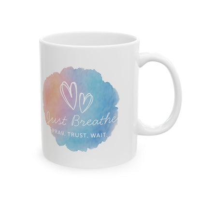 White mug with a colorful watercolor design and text on a white background