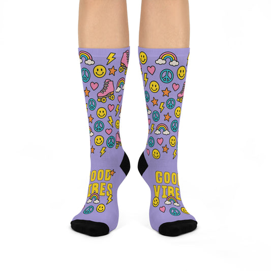 Purple socks with colorful designs and text on a white background