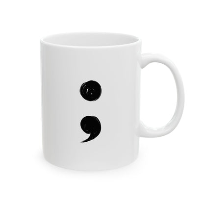 White mug with black semicolon design on a white background