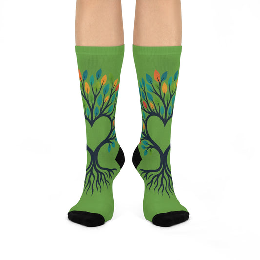Green socks with tree design on a white background