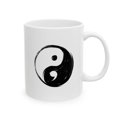 White mug with a black yin yang symbol on a white background