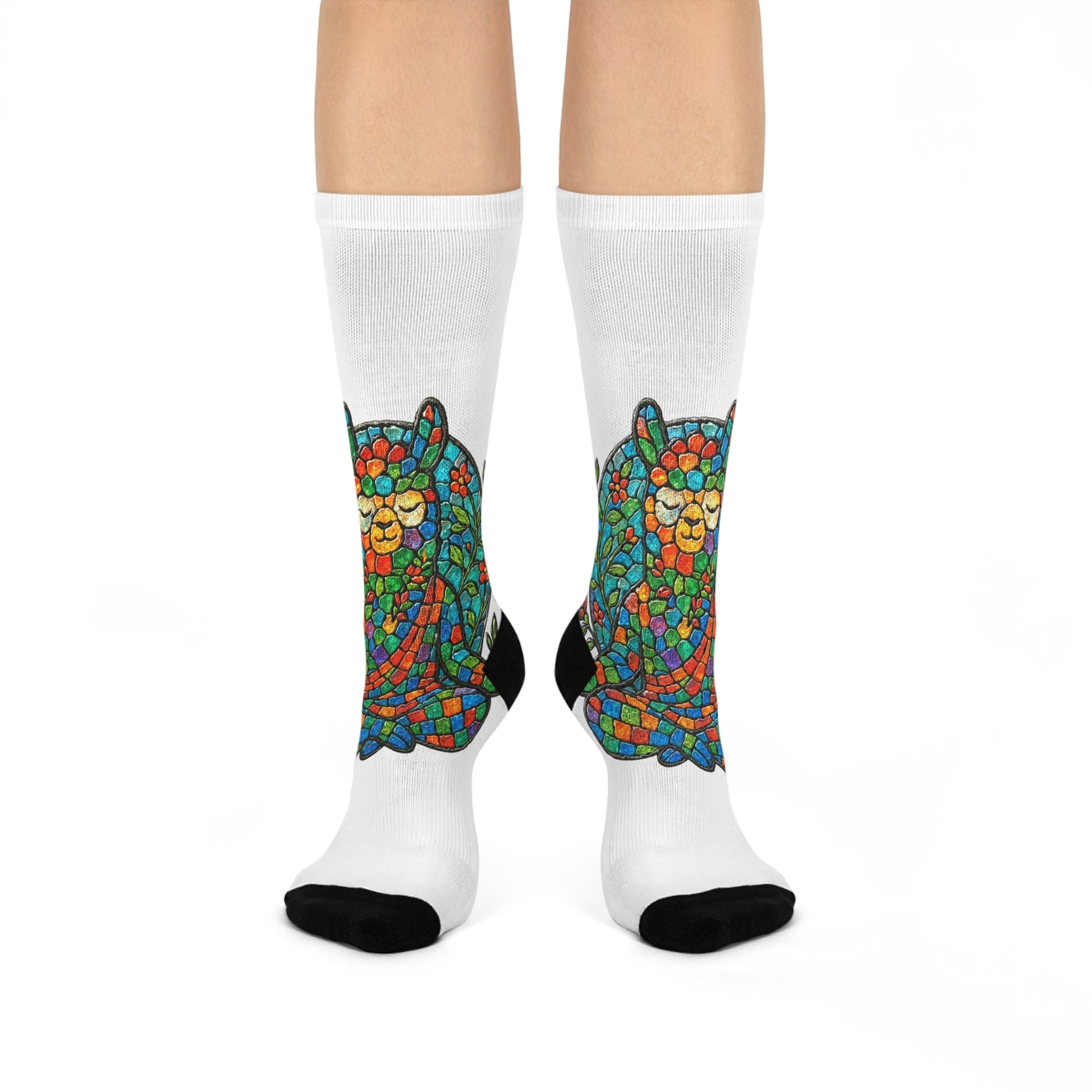 Colorful meditating llama sock design on white socks with a white background