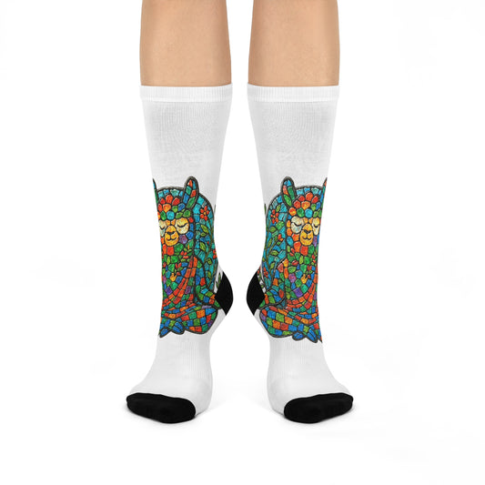 Colorful meditating llama sock design on white socks with a white background