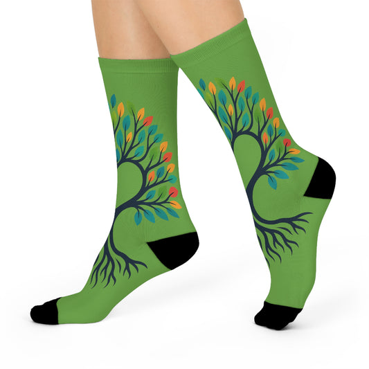 Green socks with a tree design on a white background